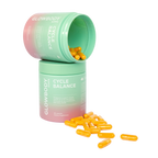 Two containers of Glowbody Supps Cycle Balance supplements with scattered orange capsules on a white background. Female multi vitamin