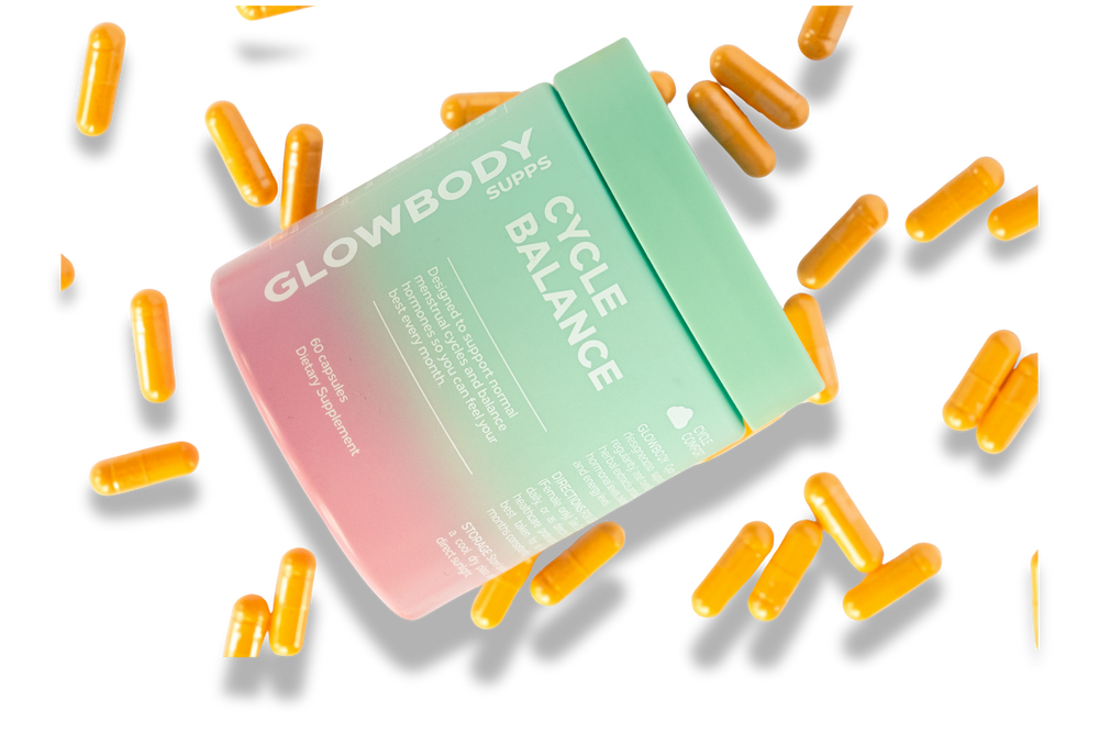 Glowbody Supps Cycle Balance Supplement packaging with orange capsules scattered on a white background. Female multi vitamin