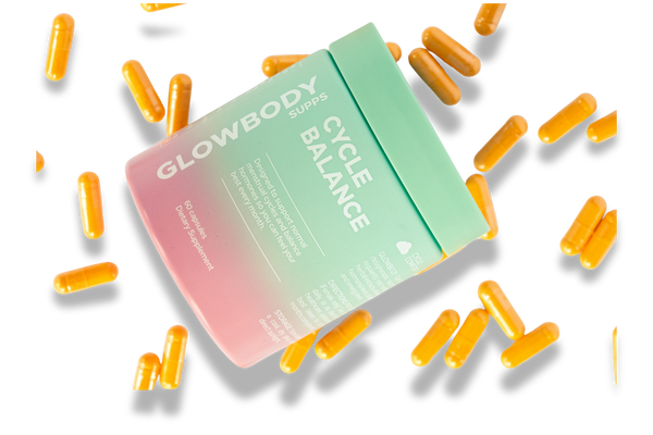 Glowbody Supps Cycle Balance Supplement packaging with orange capsules scattered on a white background. Female multi vitamin
