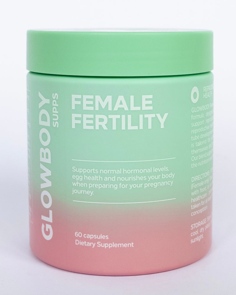 Supplement jar labeled 'Female Fertility' by Glowbody Supps on a light background