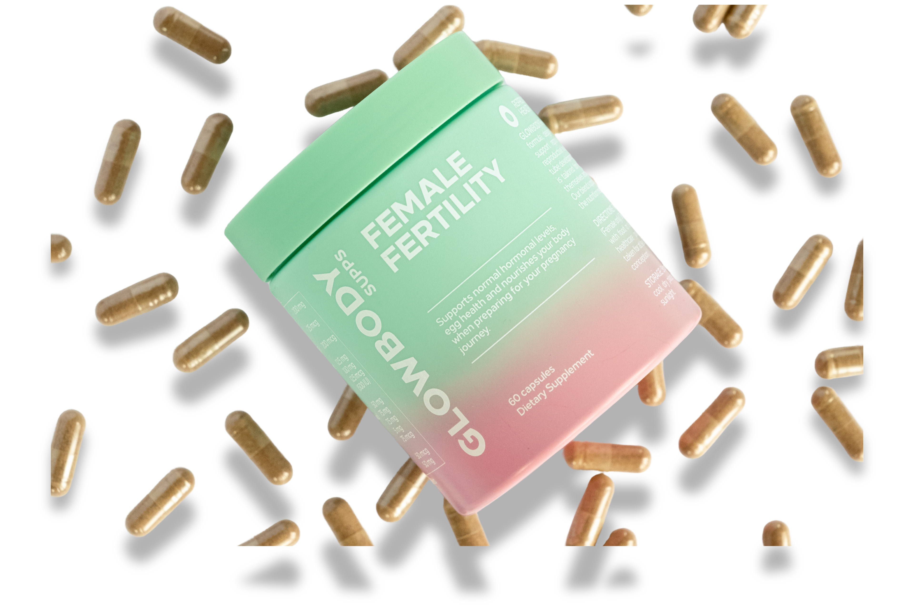 Glowbody Supps Female Fertility Supplement packaging surrounded by brown capsules on a white background. Female multi vitamin