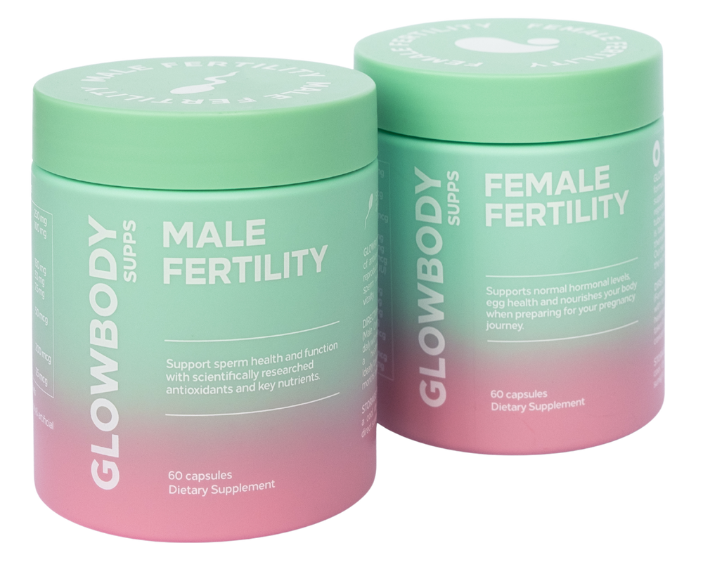 Two multivitamin supplement containers labeled 'Male Fertility' and 'Female Fertility' by Glowbody Supps on a white background.