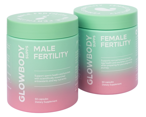 Two multivitamin supplement containers labeled 'Male Fertility' and 'Female Fertility' by Glowbody Supps on a white background.