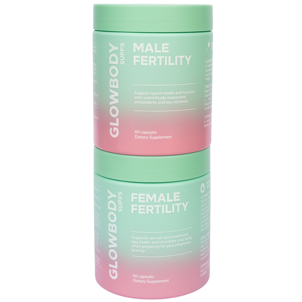 Two multivitamin supplement containers labeled 'Male Fertility' and 'Female Fertility' by Glowbody Supps on a white background.