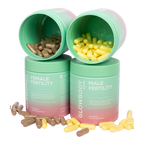 Two multivitamin supplement containers labeled 'Male Fertility' and 'Female Fertility' by Glowbody Supps with their respective capsules on a white background.