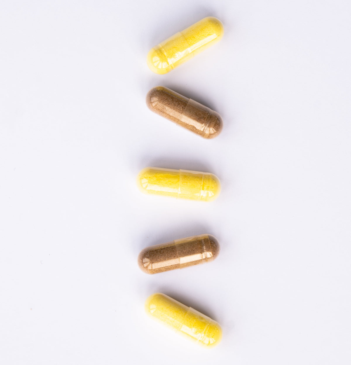 Colourful capsules on a white background