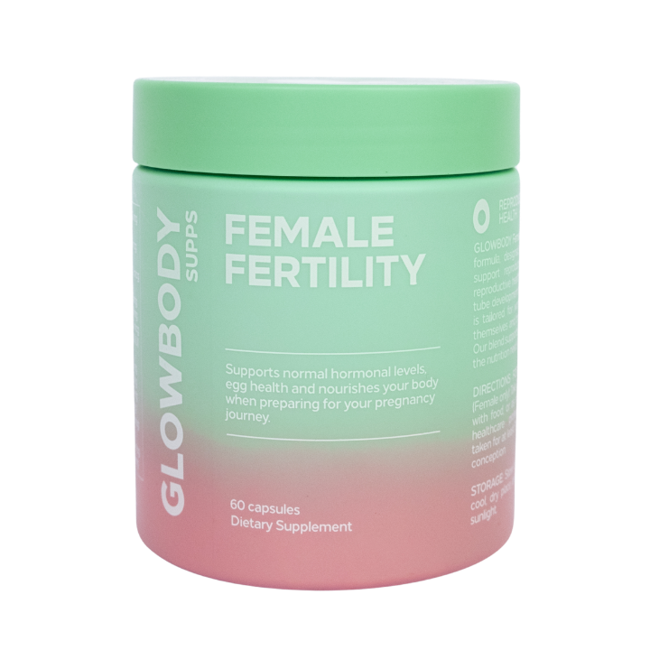 Supplement jar labeled 'Glowbody Supps Female Fertility' with a gradient design on a white background.